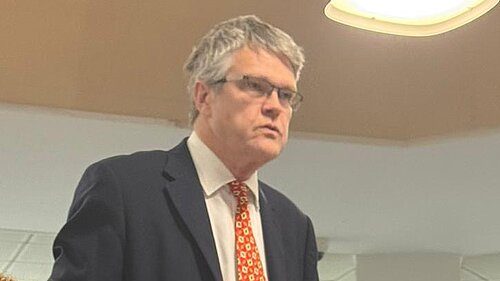 Cllr Jon Ball speaking at a council meeting