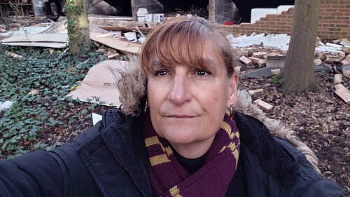 Cllr Athena Zissimos at the site of the collapsed wall in Hanger Hill ward.
