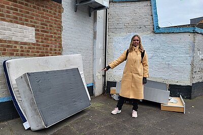 Ksenia Maximova pointing at fly-tipping