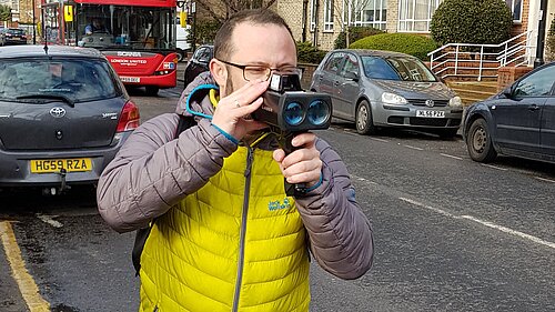 Cllr Gary Malcolm conducting speed checks on The Avenue.
