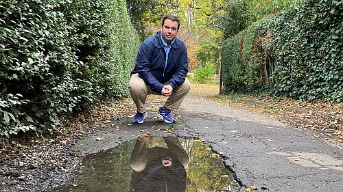 Matt Mellor on the damaged foothpath on Elers Road.