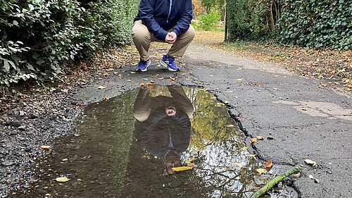 Matt Mellor on the damaged foothpath on Elers Road.