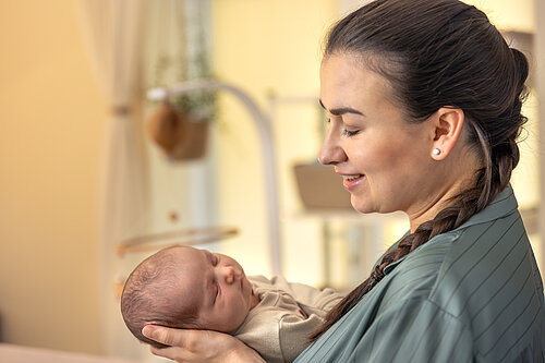 young mother with newborn baby